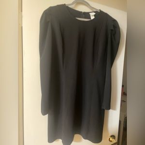 Black dress with puff sleeve and flattering silhouette